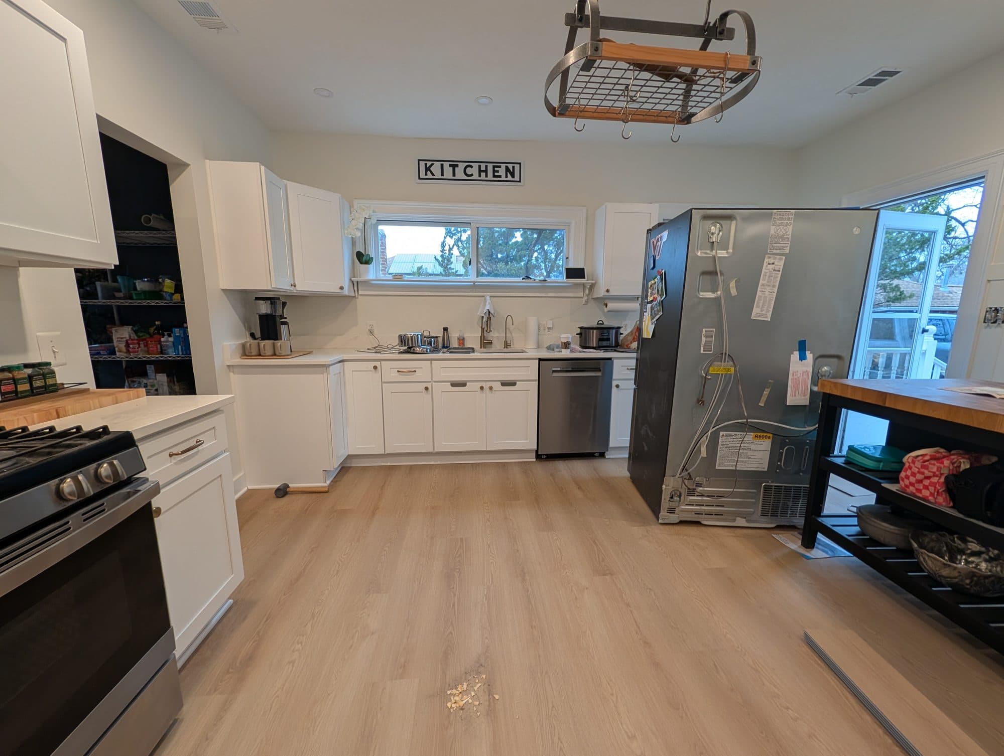 Functional kitchen remodel with white shaker cabinets and stainless appliances