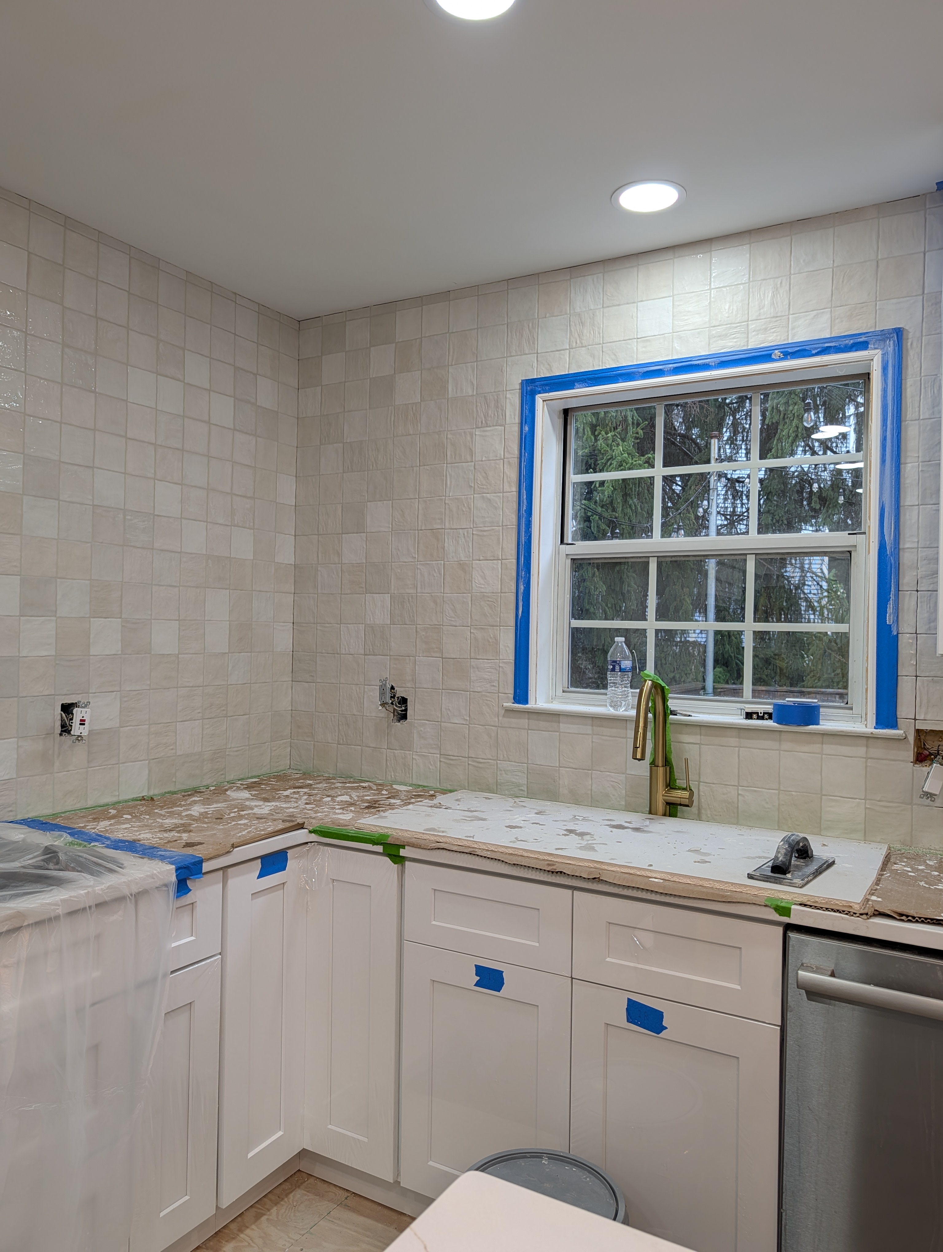 New Herndon kitchen in progress (second project), white shaker cabinets with a square tile backsplash installed
